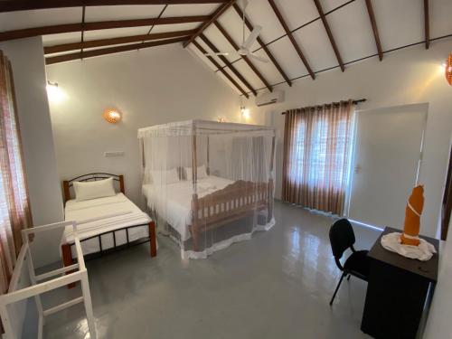 Postel nebo postele na pokoji v ubytování Kanada House Unawatuna