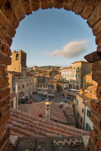a view of a city from a window at Hotel San Michele in Cortona