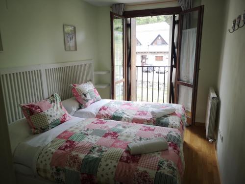 A bed or beds in a room at Apartamentos Aguas Limpias