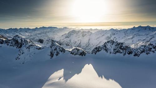 a view of a snow covered mountain with a lake at The AlpenHouse Gligic´s in Sautens