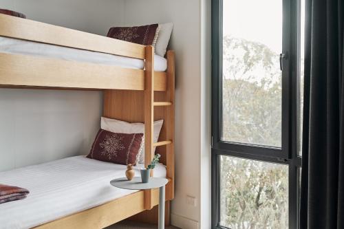 Ένα ή περισσότερα κρεβάτια σε δωμάτιο στο Huski Apartments Falls Creek