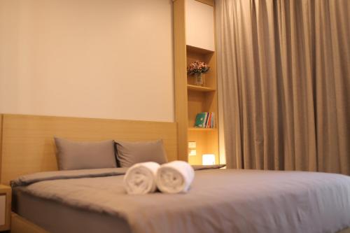 Säng eller sängar i ett rum på Lee Apartment & Hotel