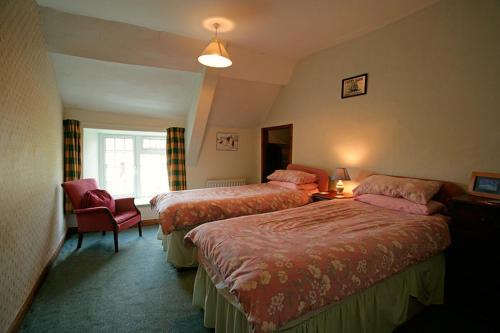 Ліжко або ліжка в номері Doubleton Farm Cottages