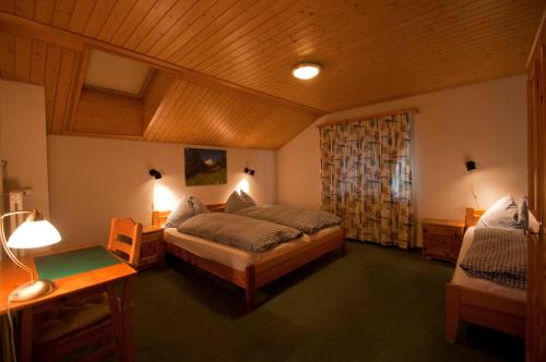 a bedroom with a large bed and a window at Dent Blanche in Zermatt