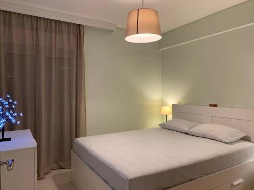 Кровать или кровати в номере New luxury apartment in central suburb of Athens