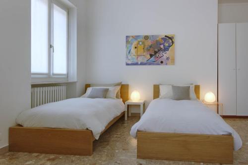 Postel nebo postele na pokoji v ubytování Milan Apartment Rental