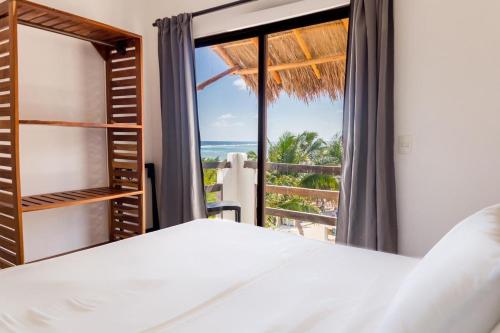Postel nebo postele na pokoji v ubytování Hotel Blue Reef frente al mar