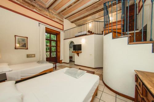 מיטה או מיטות בחדר ב-Hotel Colonial
