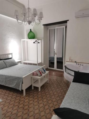 a bedroom with a bed and a bath tub at La Serva Padrona in Taranto