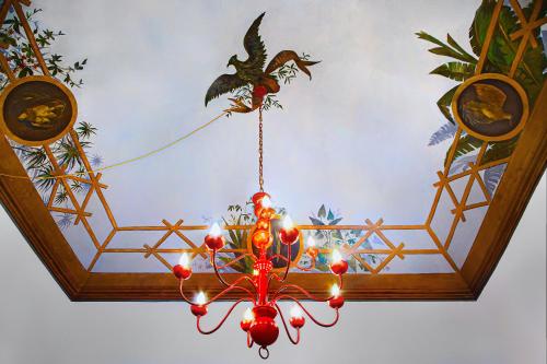 a chandelier hanging from a ceiling in a room at Naca Suite in Catania