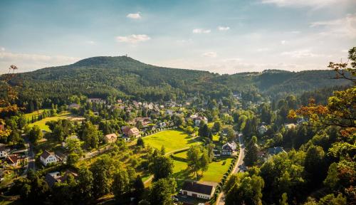 an aerial view of a small town in the mountains at Ferienwohnung Gustav Kaiser Apartment - 60qm Design Fewo Zittauer Gebirge - Unterkunft in historischer Altstadt im Dreiländereck in Zittau