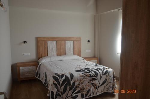 מיטה או מיטות בחדר ב-La Quintana del Castillo