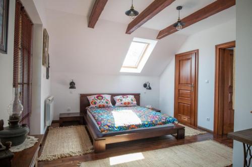 a bedroom with a bed in a room at Siedlisko Poleski Zakątek in Lejno