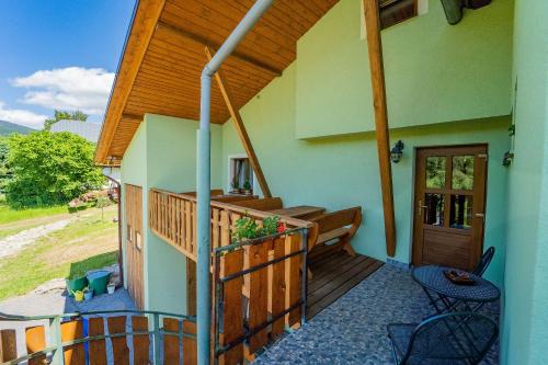 a balcony of a house with a wooden railing at Apartmány U Žaloudků in Dolní Morava