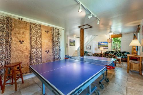 a room with a ping pong table in it at Hale Naninoa home in Hanalei