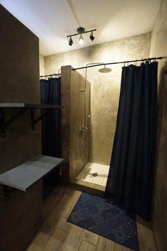 a bathroom with a shower with a shower curtain at Casa Coral in Luquillo