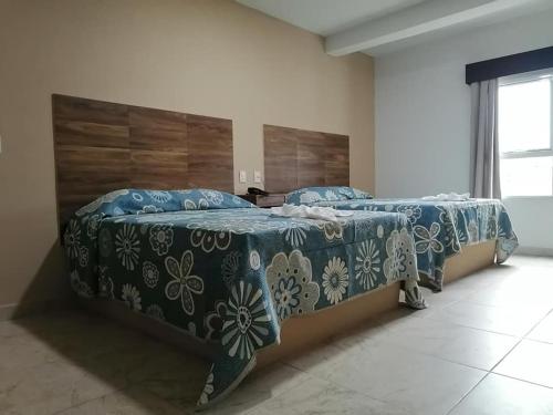 Postel nebo postele na pokoji v ubytování Hotel Las Vias