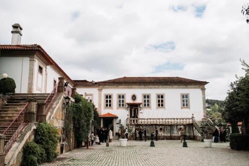 a view of the front of a white building at Quinta do Paço Hotel in Vila Real
