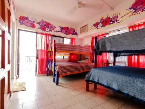 Postel nebo postele na pokoji v ubytování Hostel Vallarta