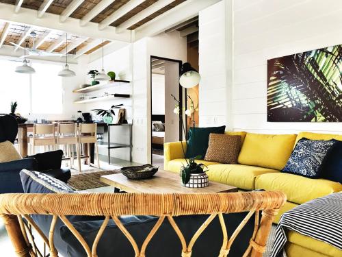 a living room filled with furniture and a couch at marAmar Bungalows by STH in Santa Teresa Beach