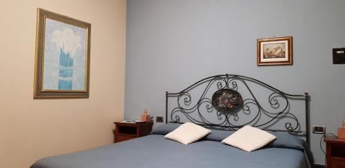 Katil atau katil-katil dalam bilik di La Regibussa - Hotel Ristorante