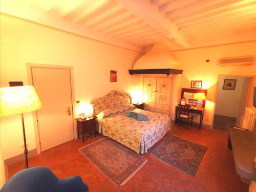 a living room with a bed and a couch at Hotel San Michele in Cortona