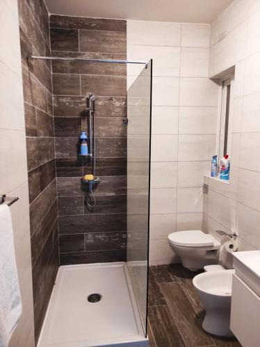 a bathroom with a shower and a toilet at Hillock Residence Gozo Marsalforn in Marsalforn