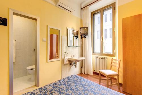 Koupelna v ubytování Hotel Romagna