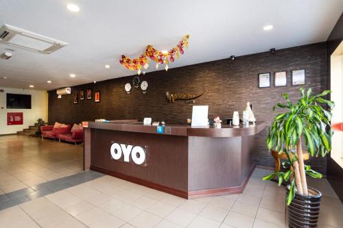 a lobby of a restaurant with a reception desk at I Harmony Hotel in Johor Bahru