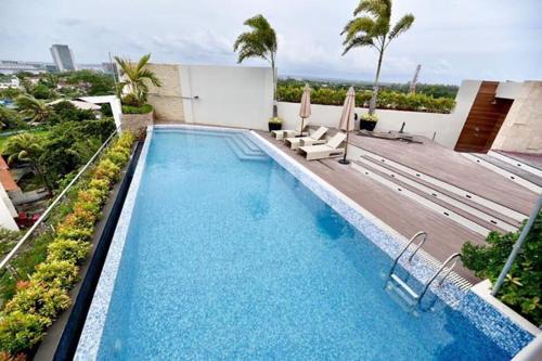 a swimming pool on top of a building at J7 Plaza Hotel in Iloilo City