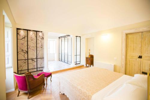 Postel nebo postele na pokoji v ubytování B&B Attico Taranto