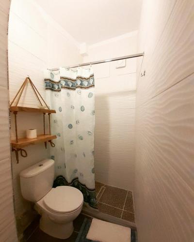 a bathroom with a toilet and a shower at At Pikotiko's - Korca City Rooms for Rent in Korçë