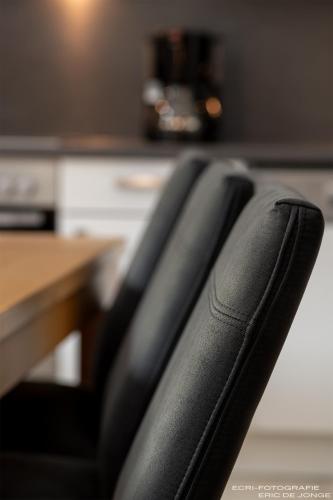 a black office chair in front of a desk at Appartments Gerlos Am Bach - Riverside in Gerlos