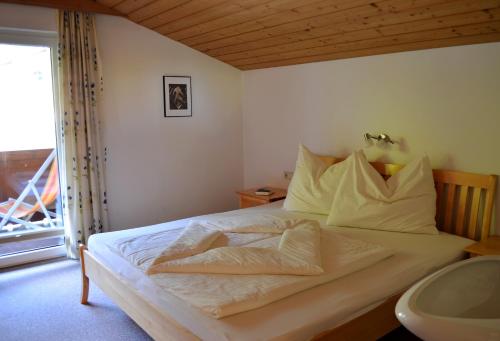 Posteľ alebo postele v izbe v ubytovaní Haus Hofer