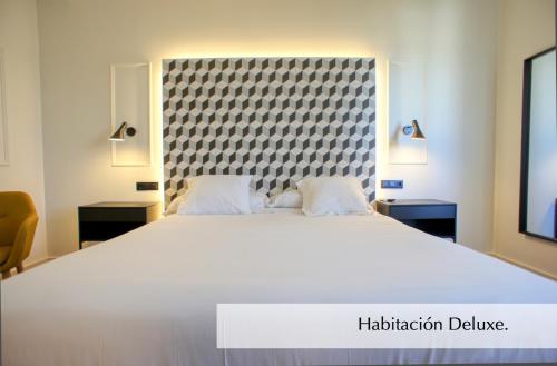 Ένα ή περισσότερα κρεβάτια σε δωμάτιο στο Hotel Montermoso