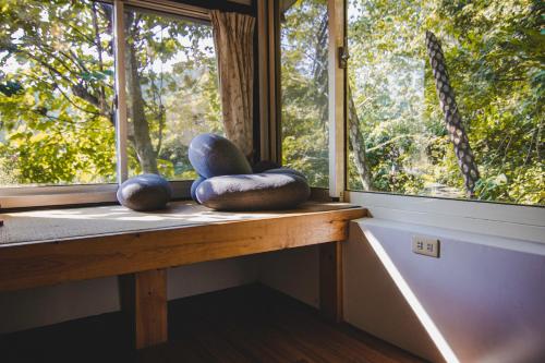 a window with two meditation spheres on a window sill at Futen Villa in Sanyi