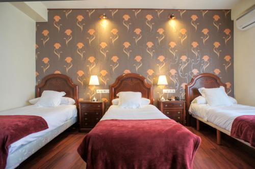 Ένα ή περισσότερα κρεβάτια σε δωμάτιο στο Hotel Montermoso