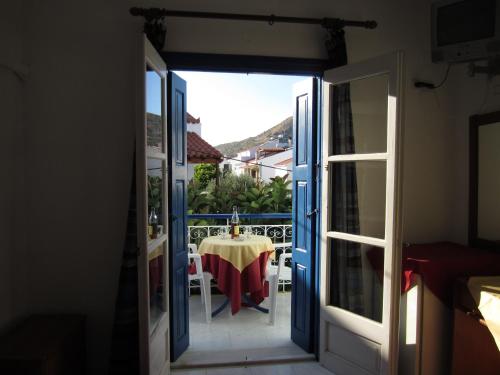 a view from the door of a room with a table at Hotel Mariona in Pythagoreio