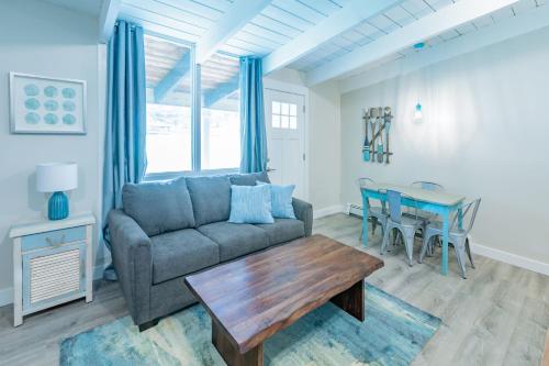 a living room with a couch and a table at Boutique Suite #5 in Blue Mountains