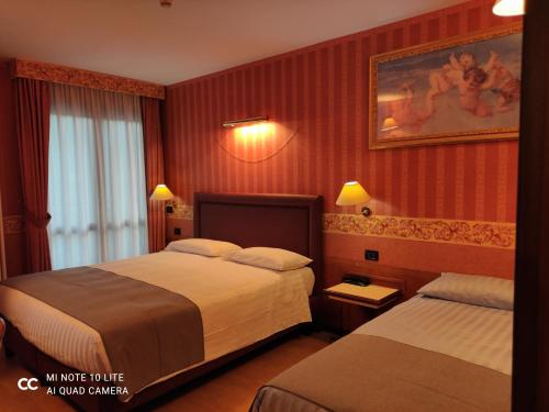 A bed or beds in a room at Val Del Rio