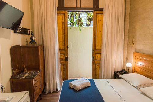 Cama o camas de una habitación en Pousada Dom Petrópolis