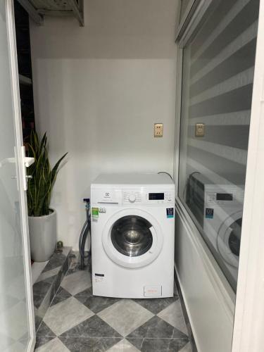 a washer and dryer in a small room at Khánh Phong Apartment in Waterfront in Hai Phong