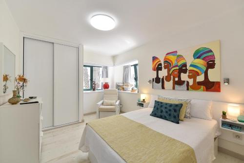 Ένα ή περισσότερα κρεβάτια σε δωμάτιο στο Maspalomas Beach Apartment Charca 1 by VillaGranCanaria