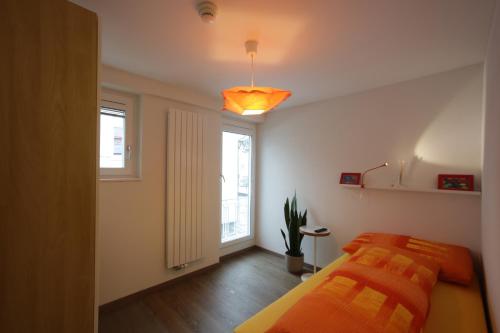 a bedroom with two beds and a window at Landgasthof Hirschen in Diegten