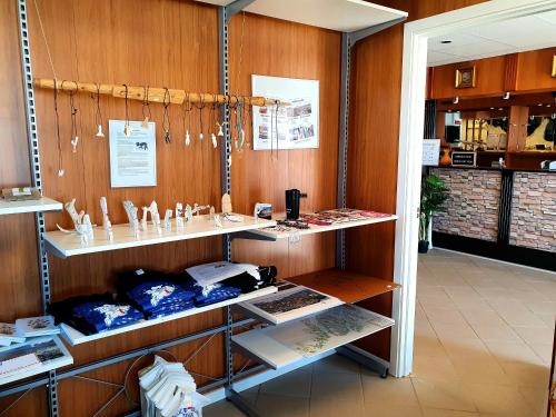 a store with shelves in a room with wooden walls at Hotel Kulusuk in Kulusuk