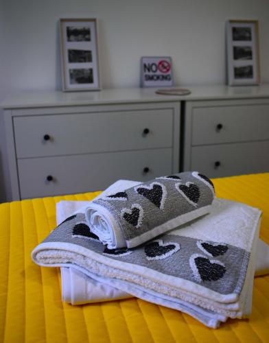 two towels sitting on top of a bed at Agape C-52 in Trebinje
