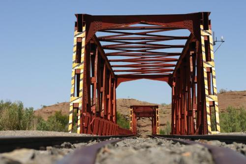 an old red bridge in the middle of the desert at Seeheim Hotel in Seeheim