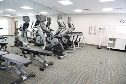 a gym with several treadmills and elliptical machines at Holiday Inn Express & Suites - Wylie West by IHG in Wylie