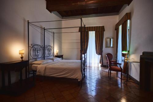 Llit o llits en una habitació de Hotel Villa Ciconia