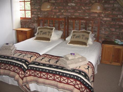 Ліжко або ліжка в номері Intaba Lodge